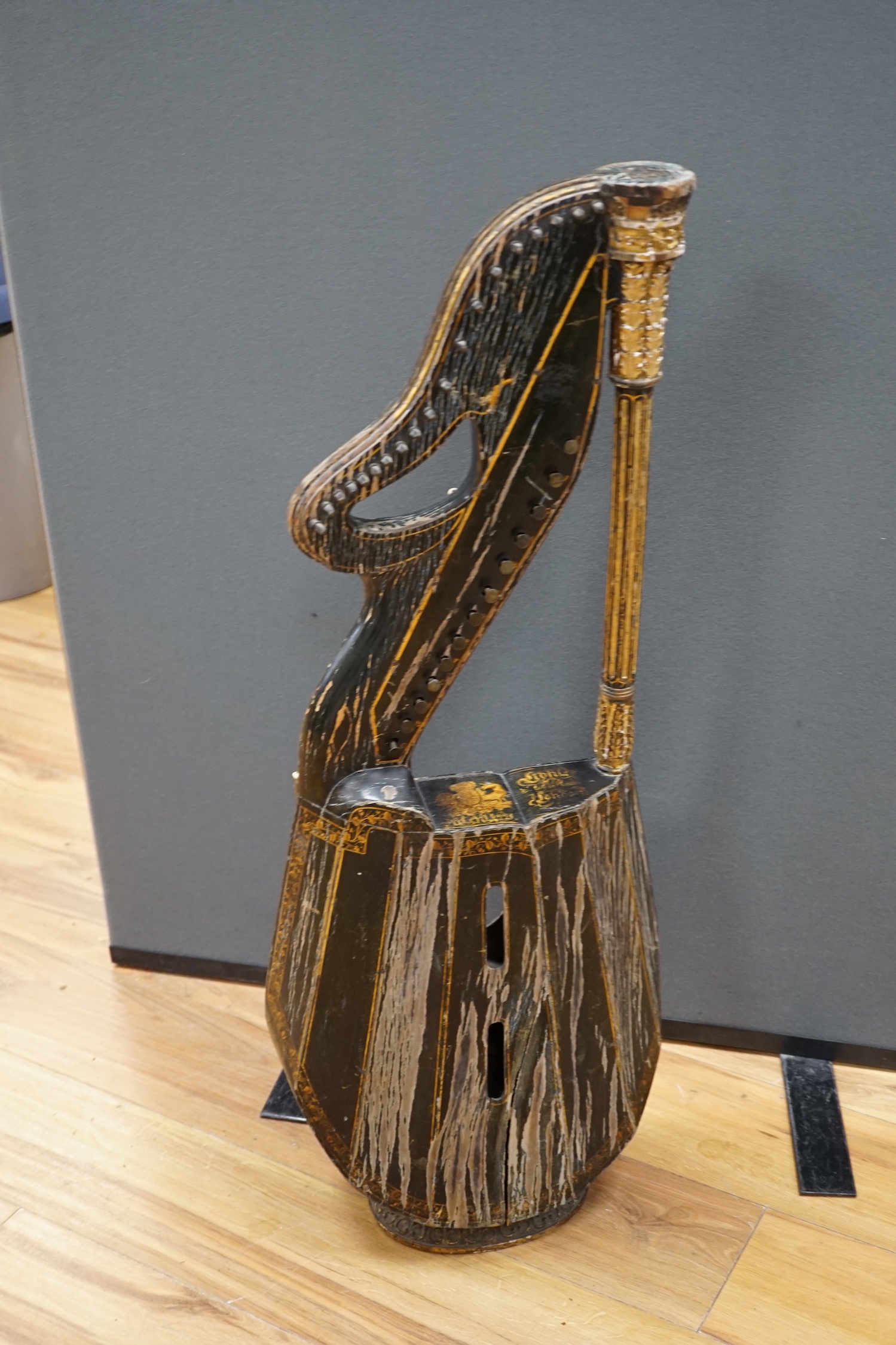 A Georgian parcel gilt and ebonised harp-lute by Edward Light, with fluted pillar, Royal coat of arms above patent number and ‘Light, Toley Place, London’, buttons to reverse with note letters, 88.5cm high CITES Submissi